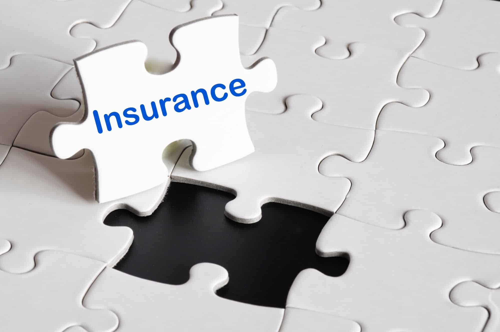 white puzzle piece with the word insurance
